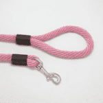 Pink dog leash with metal clip.