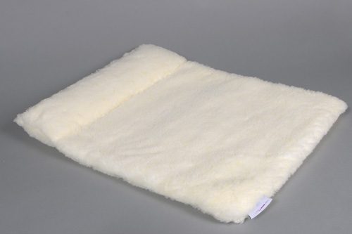 White fluffy pet bed on gray background.